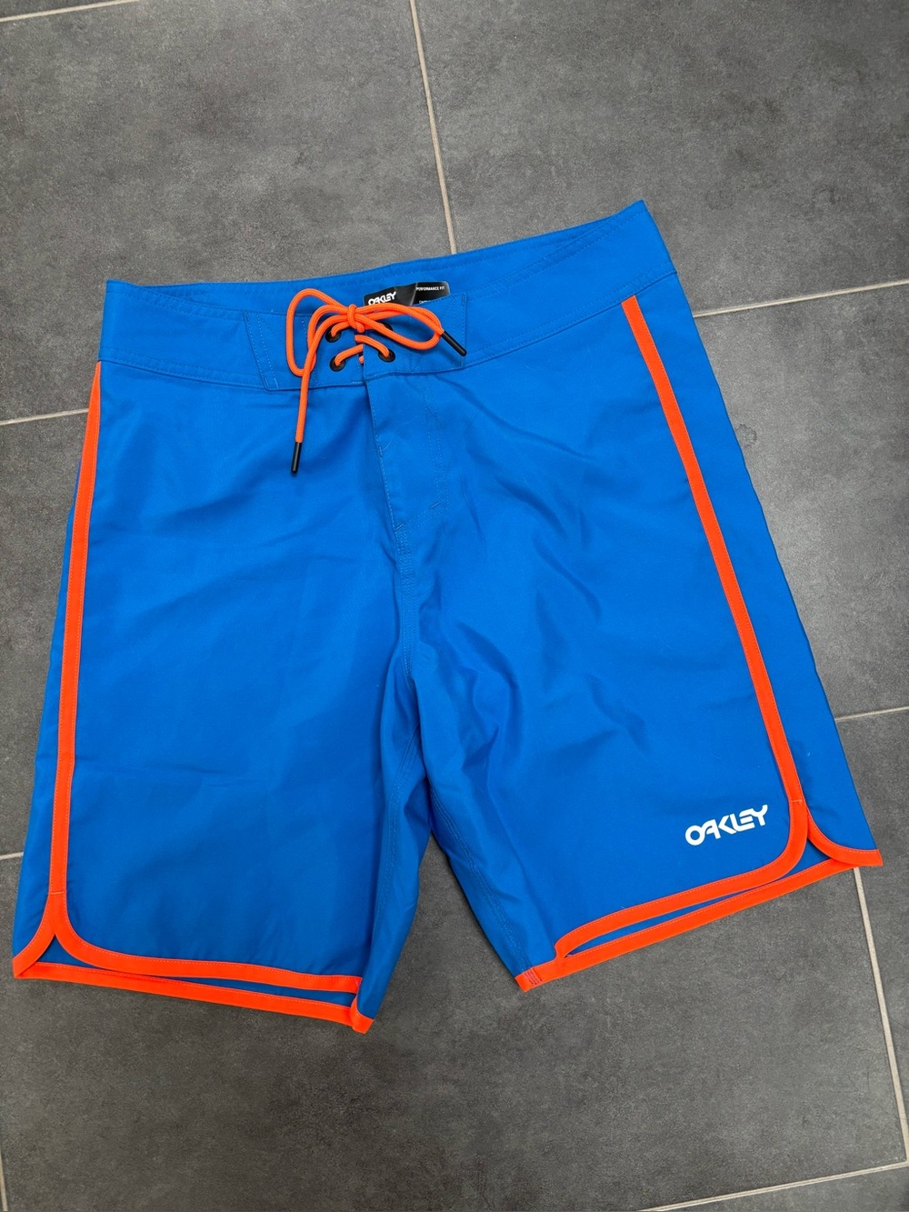 Oakley Men’s Bright Blue Board Shorts with Orange Trim